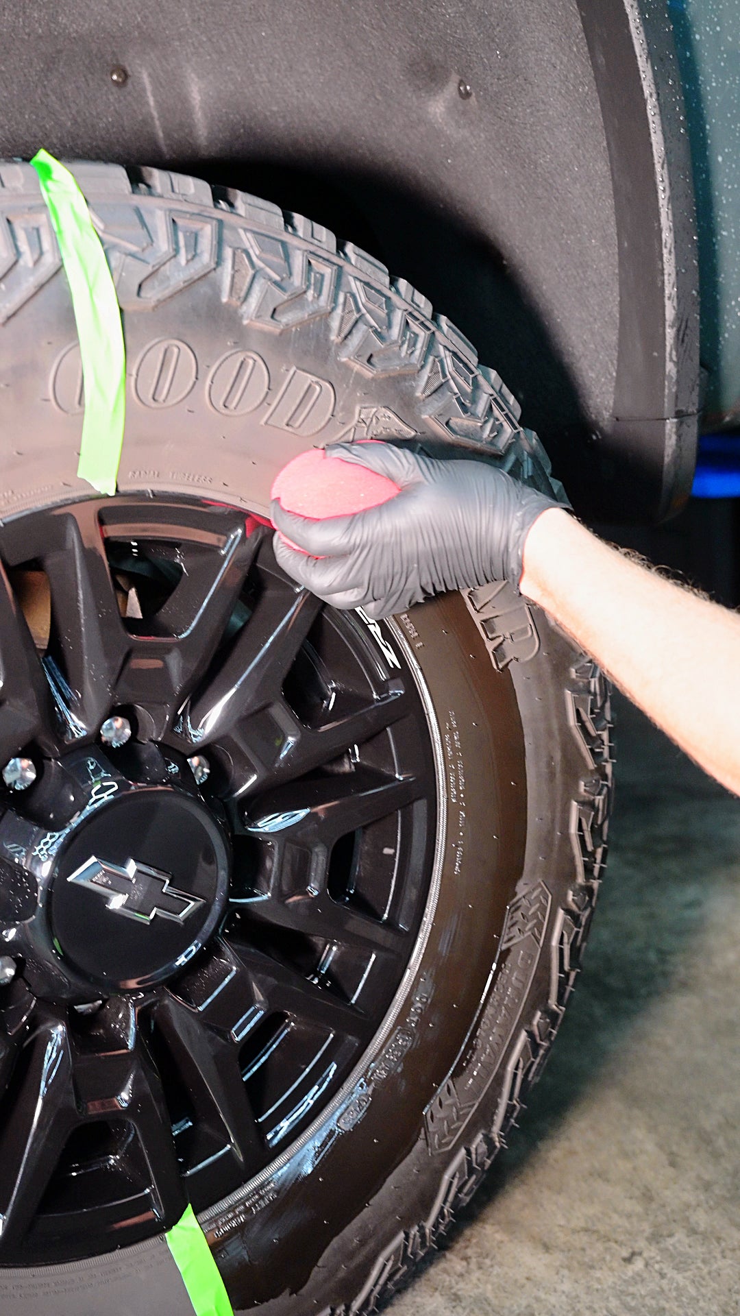 JJ's Wet Tire Dressing in use: wiping it on beside the tape