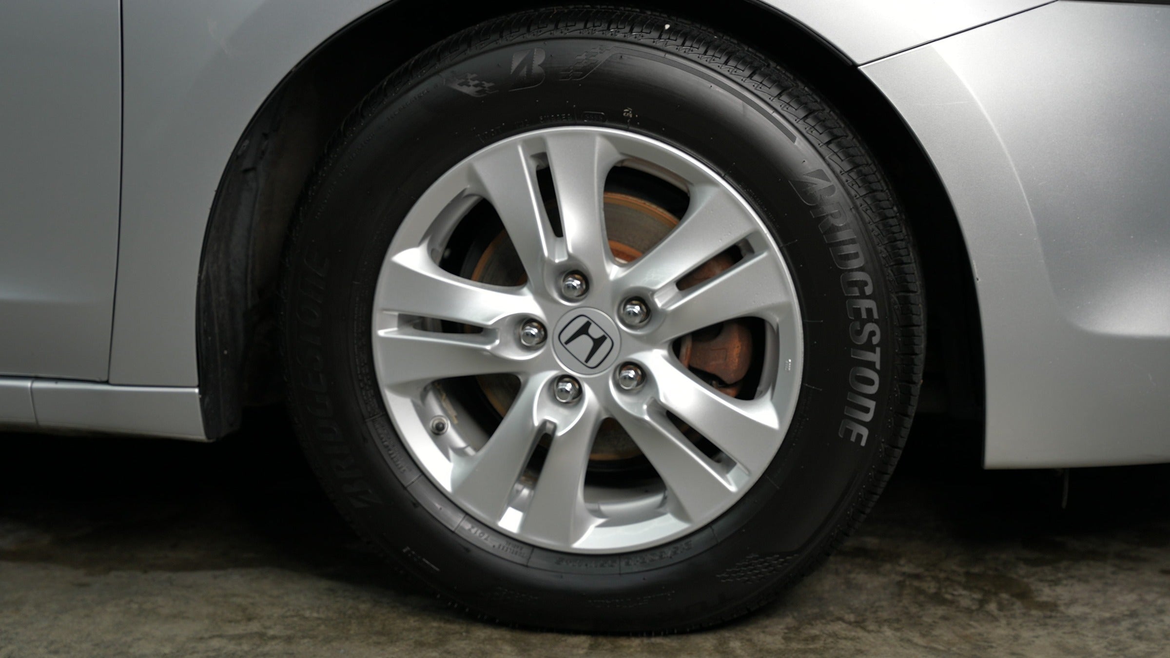 Tire dressed to a deep wet-black finish