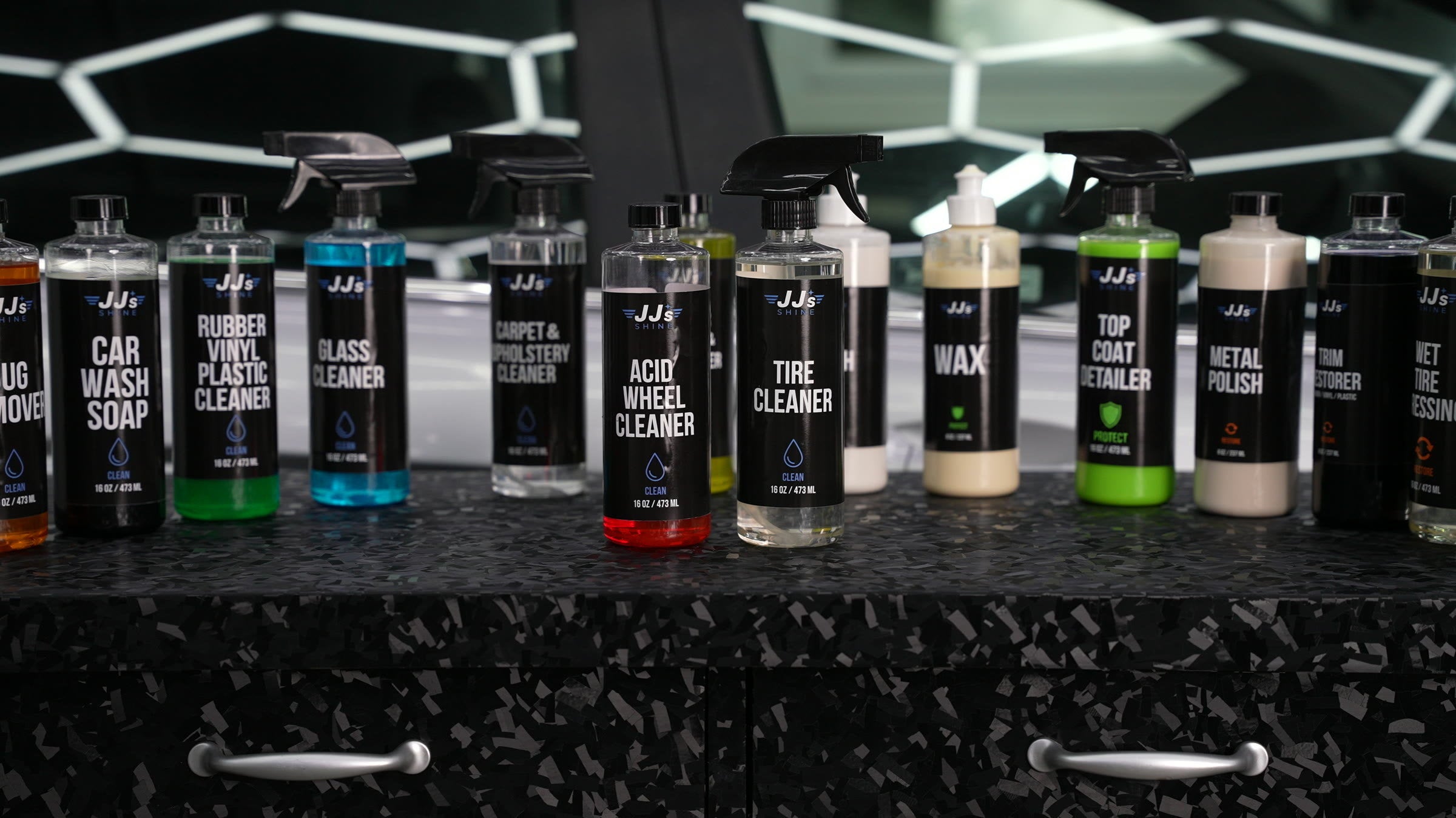 The JJ Shine product lineup on a detailing bench