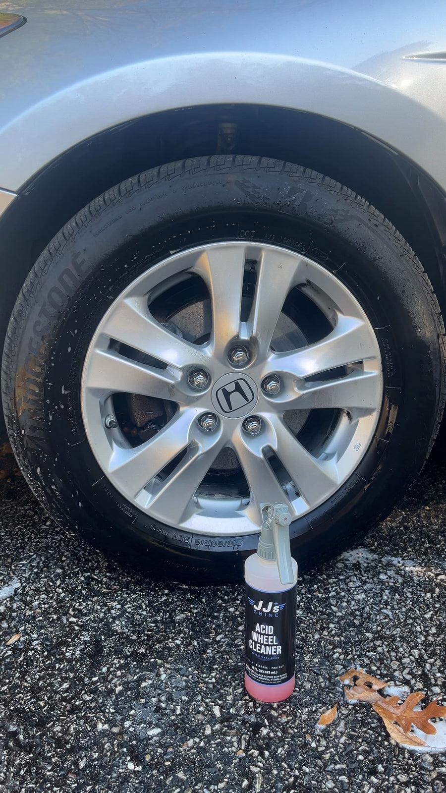 The same wheel clean, the bottle standing in front of it